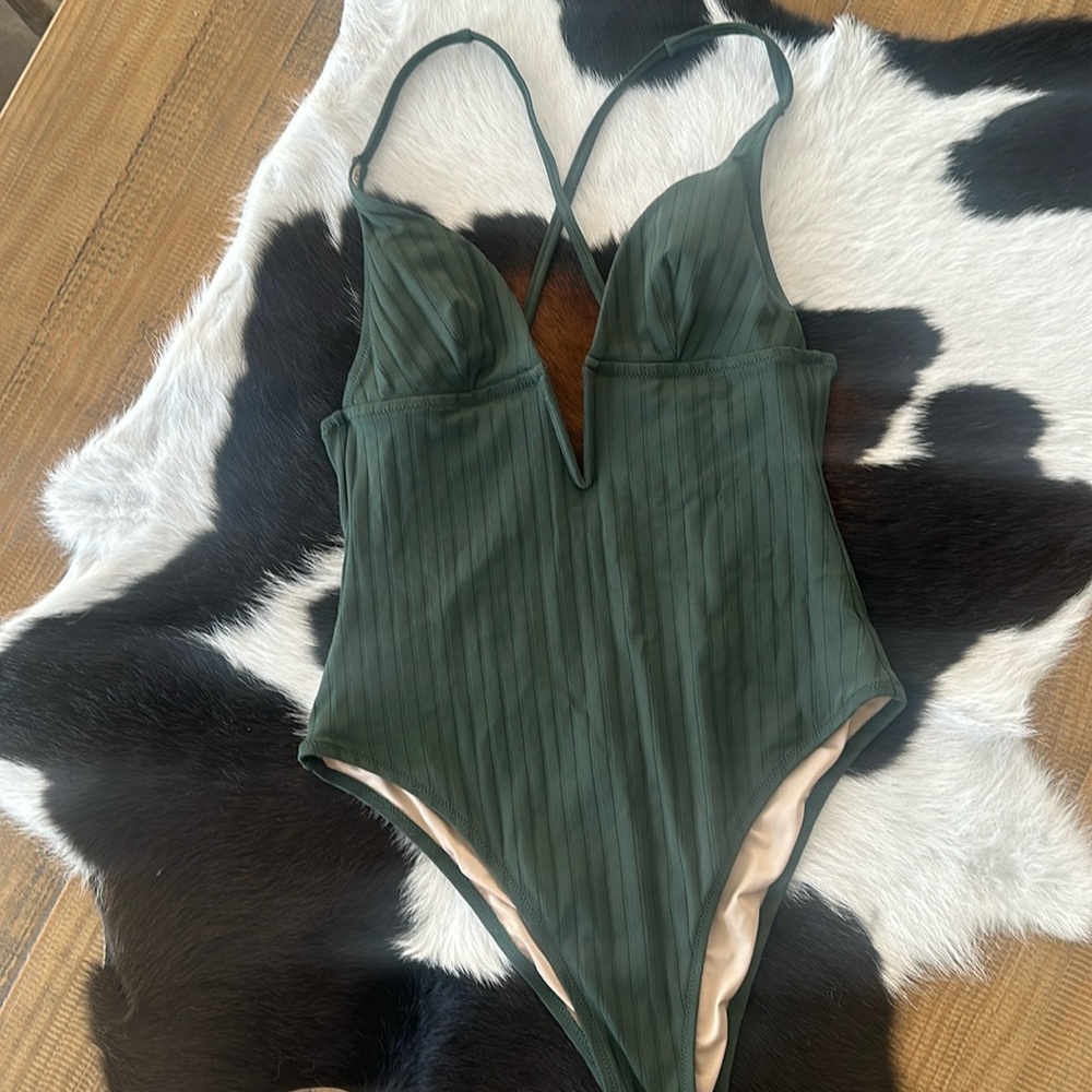 Low cut one piece swim suit medium